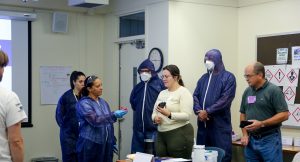 Students from the HAZWOPER and Asbestos Contractor/Supervisor course performing a hands-on exercise.