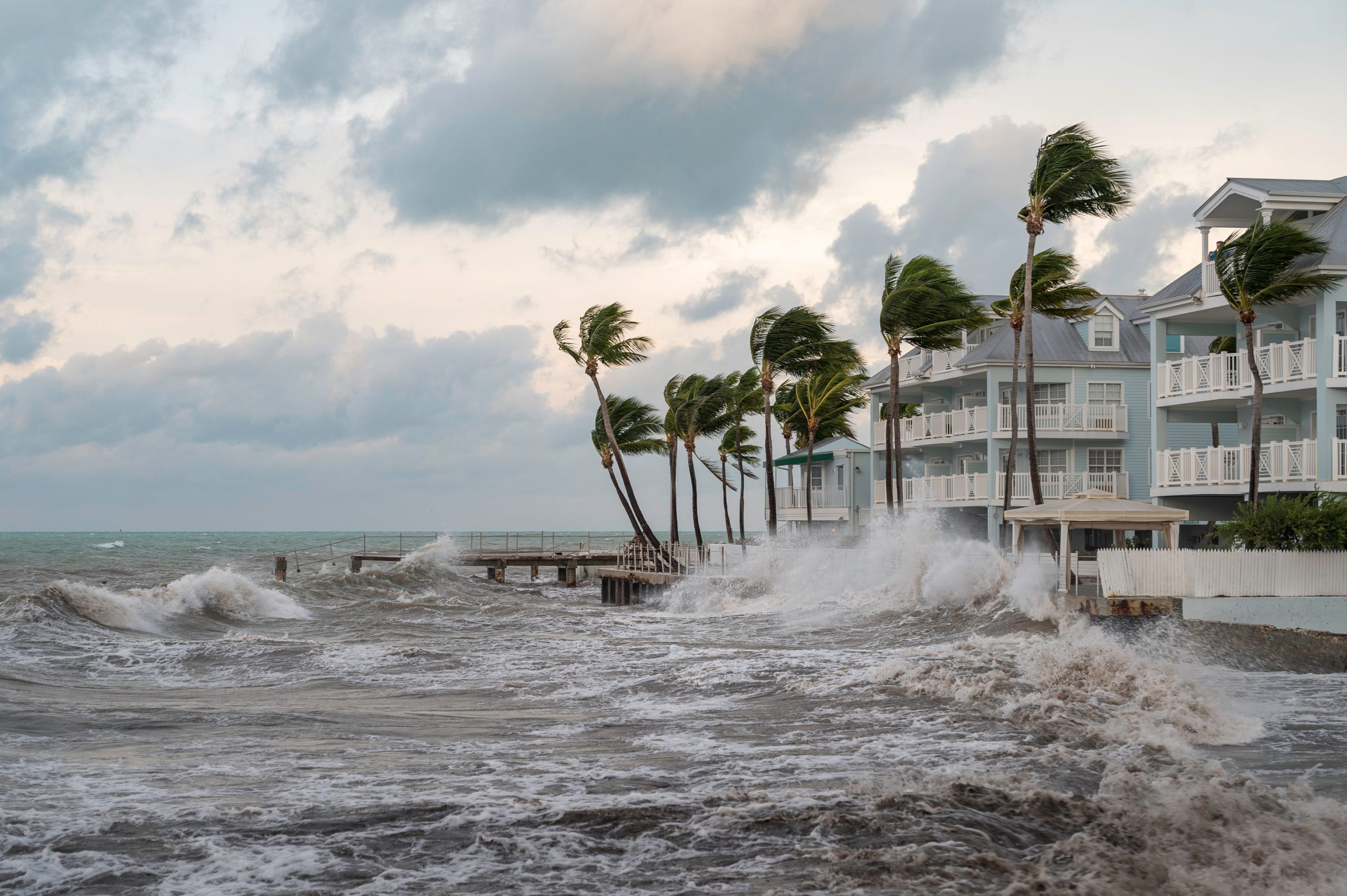 Storm surge waves crashing along Florida Keys coastline during Hurricane Irma, highlighting hurricane preparedness for water systems
